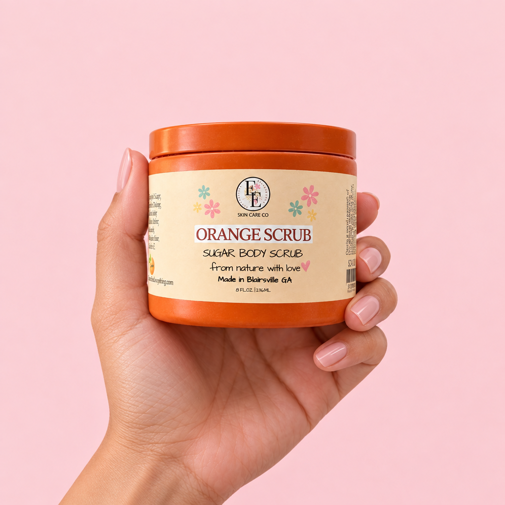 Orange Sugar Scrub jar held in hand