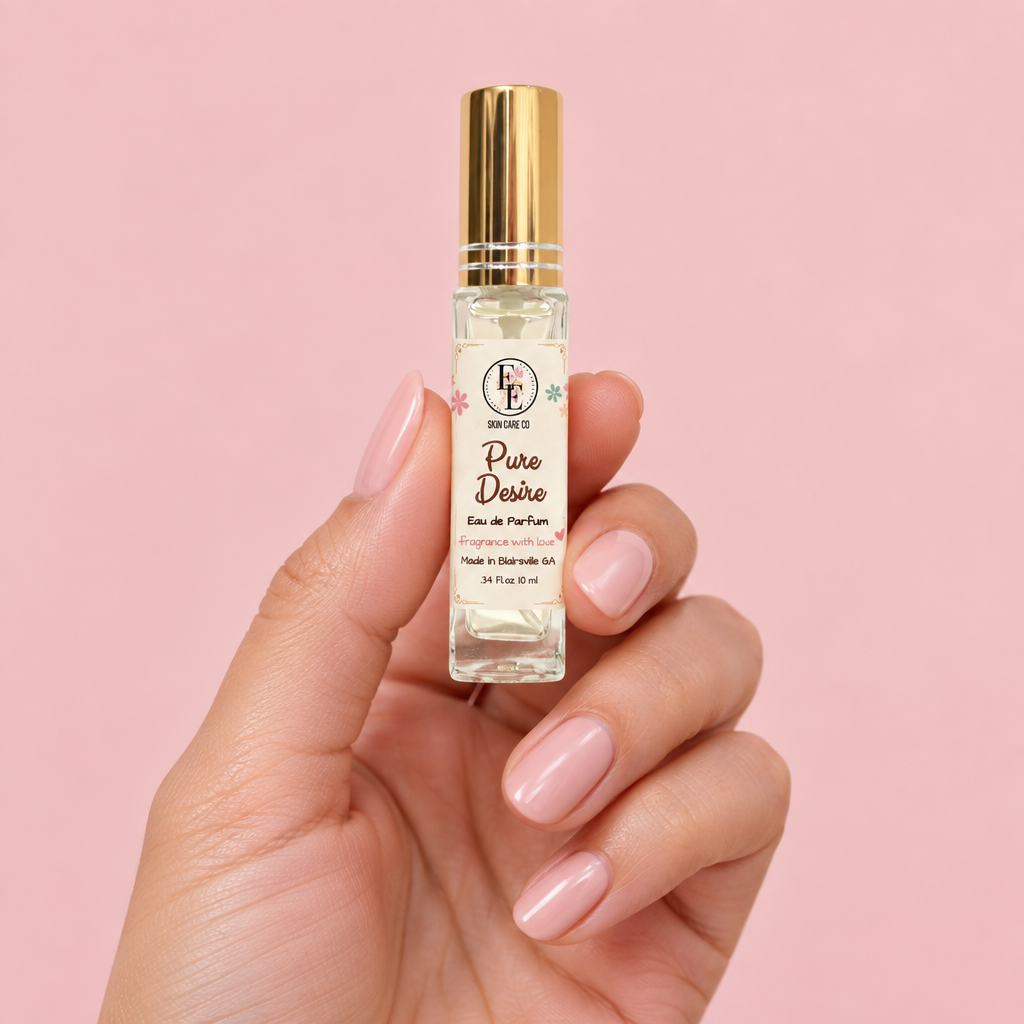 Pure Desire travel perfume held in hand