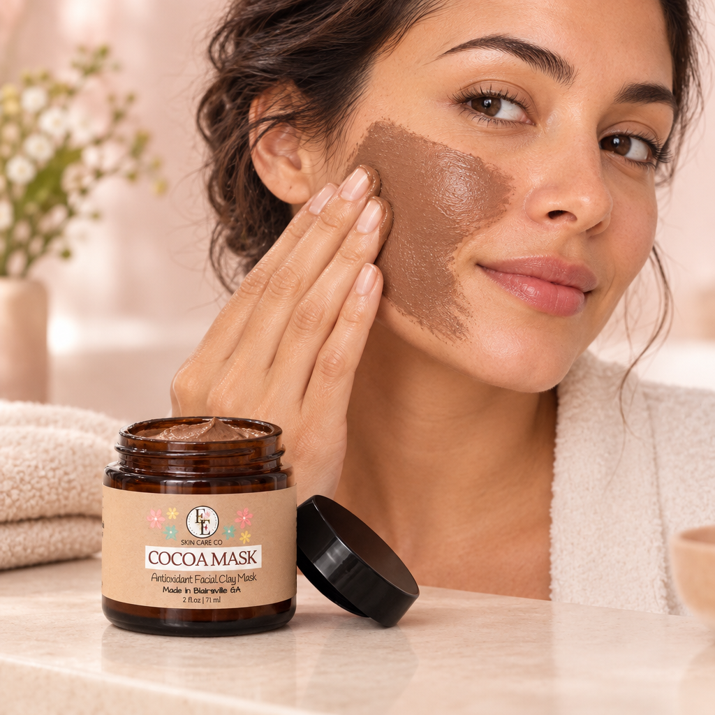 Woman applying Cocoa Clay Mask to her cheek